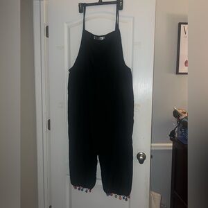 Black jumpsuit with colorful polka dot detailing